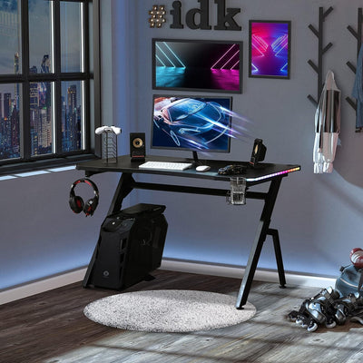 Maplin Plus Racing Style Gaming Desk with RGB LED Lights, Carbon Fibre Surface, Headphone Hook, Cup Holder & Controller Rack - maplin.co.uk